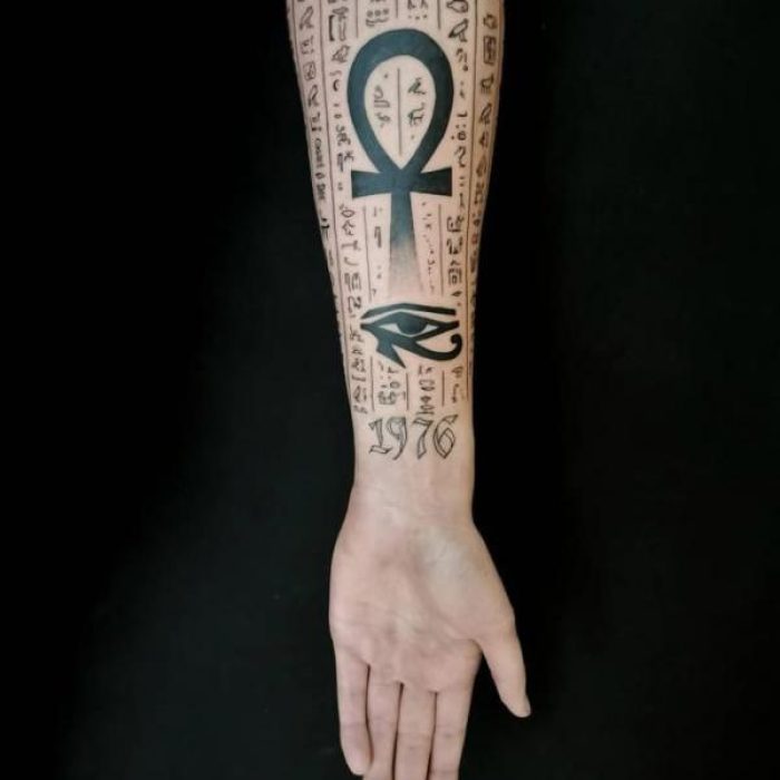 Ankh-cross-and-eye-of-Horus-on-backdrop-of-hieroglyphs